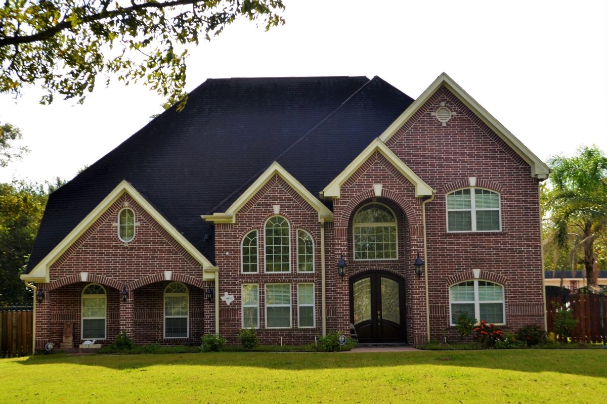 a large brick house with Property Insurance in Fort Mill, SC, Charlotte, Concord, NC, Gastonia, Matthews, NC