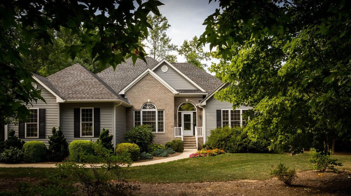 Front of Home with Trees with Home Insurance in Fort Mill, SC