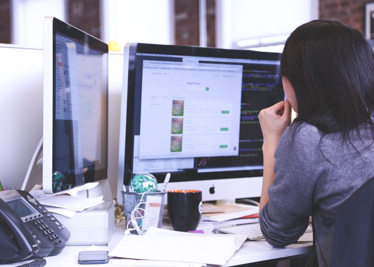 Woman on Computer at Desk with Business Insurance in Matthews, NC